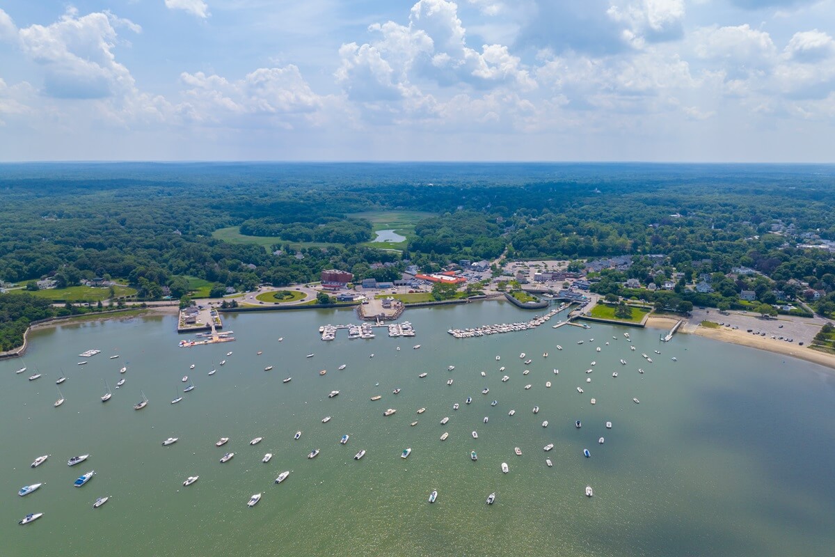 Hingham harbor aerial view including historic waterfront village and marina center in town of Hingham, Massachusetts