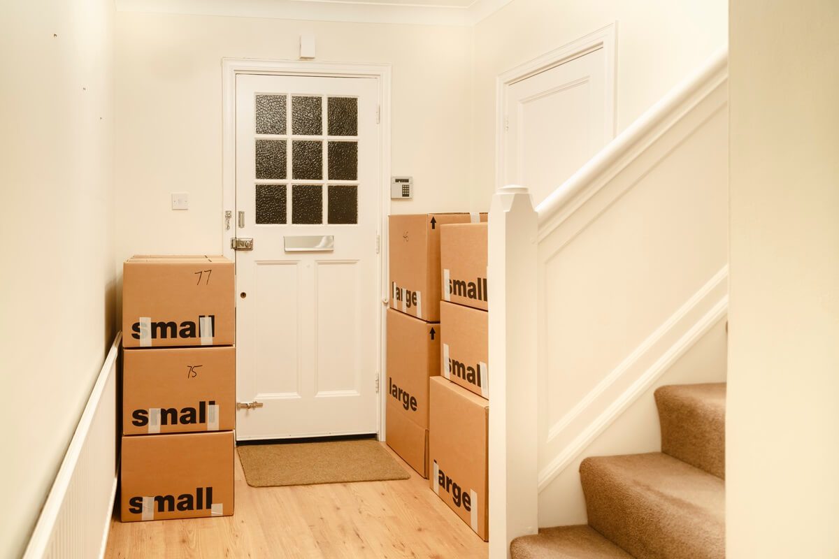 cardboard boxes packed for a house move, moving home