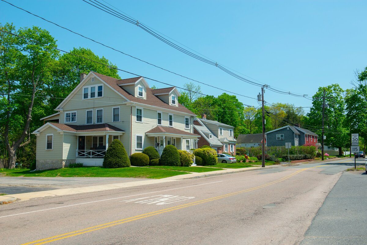 historic residential building on plain street near main street at the town center of Millis Massachusetts