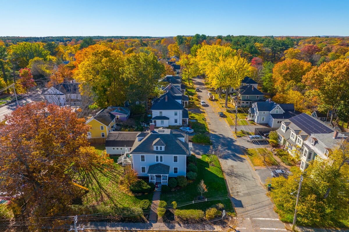 historic residential house aerial view in fall on highland street at church street in west Concord town of Concord Massachusetts