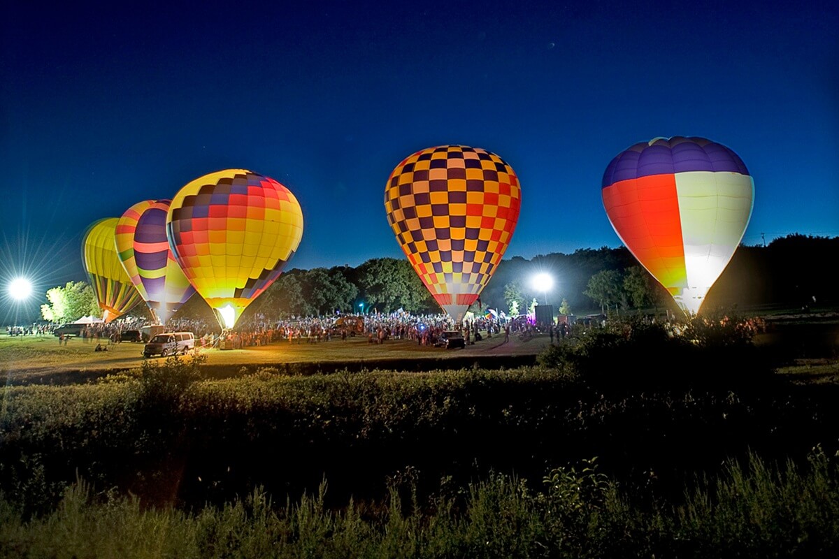 hot air balloons aglow for show in lakeway, Texas