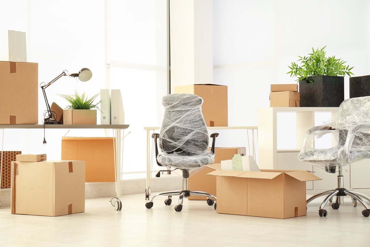 moving boxes and furniture in new office
