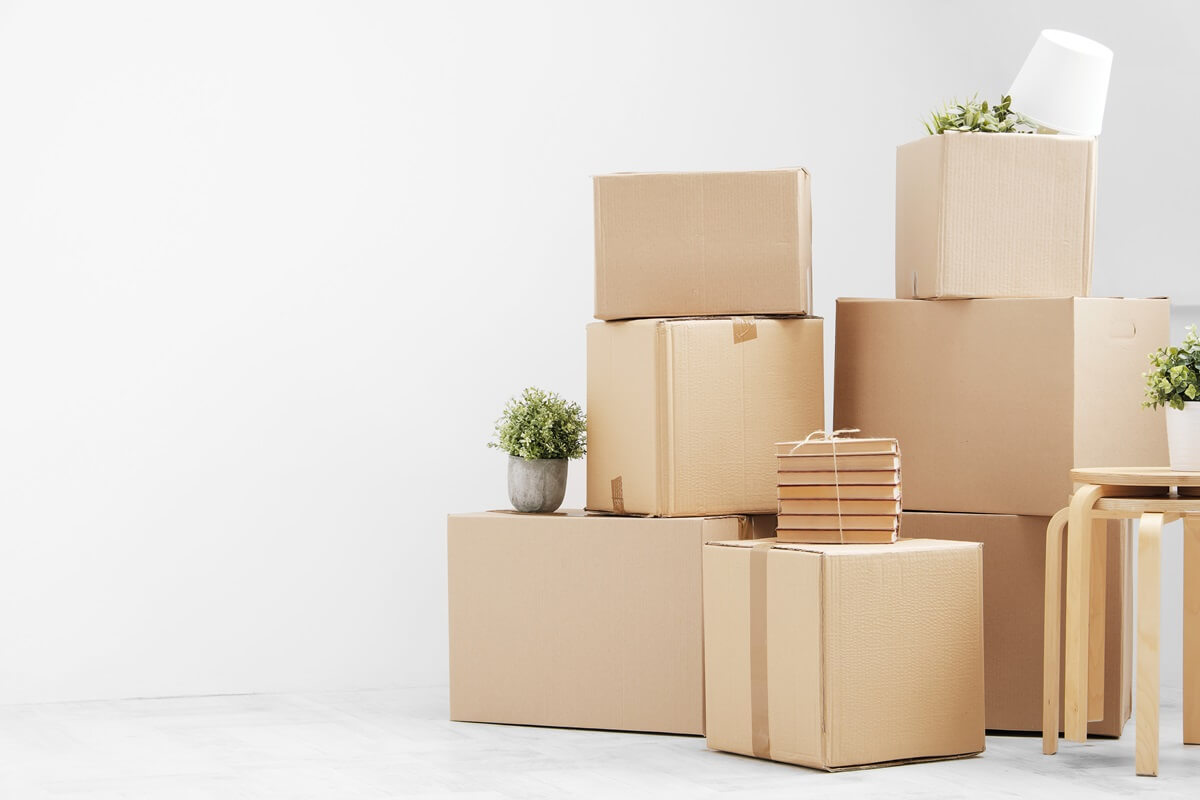 moving to a new home belongings in cardboard boxes