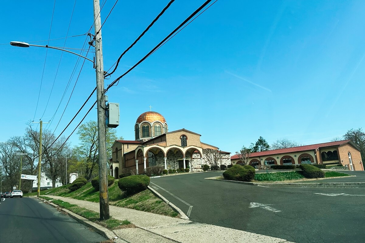 ornate annunciation greek orthodox church with golden dome surrounded by greenery in Elkins Park PA
